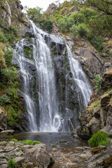 Fervenza do Toxa waterfall, a stunning 30m vertical drop in Silleda, Pontevedra, Galicia. Nature’s beauty captured in vibrant greenery and flowing water.