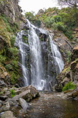 Fervenza do Toxa waterfall, a stunning 30m vertical drop in Silleda, Pontevedra, Galicia. Nature’s beauty captured in vibrant greenery and flowing water.
