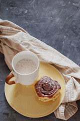 Cinnabon and Coffee on Moody Dark Surface, Top View