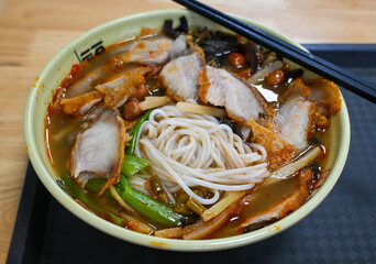 Crispy pork belly rice noodle with snails