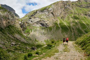 Mountaineers walking up a mountain in the Pyrenees,