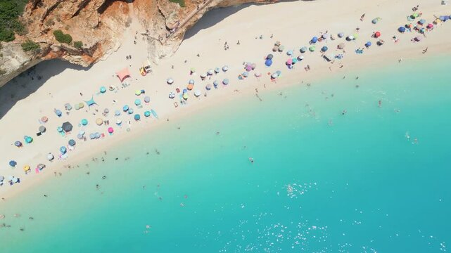 Spectacular aerial and ground views of Porto Katsiki beach on Lefkada island, Greece. Famous for its dramatic white cliffs and crystal-clear turquoise sea, this iconic Mediterranean spot 