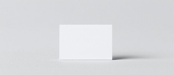 Minimalist business card mockup with clean white design.