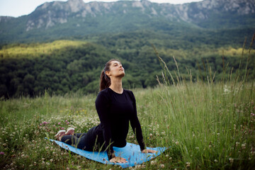 Young woman meditating in the nature