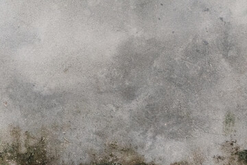 Gray cement wall displaying subtle textures and a mottled, aged appearance offering a versatile,...