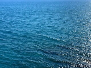 Blue sea calm rippled surface water background.