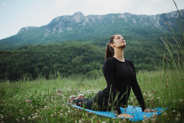 Young woman meditating in the nature