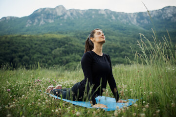 Young woman meditating in the nature