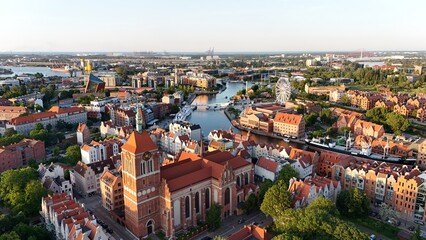 Aerial photo taken by drone over the historic tourist center of Gdansk, the city hall and the cathedral on a summer day, Poland, Europe