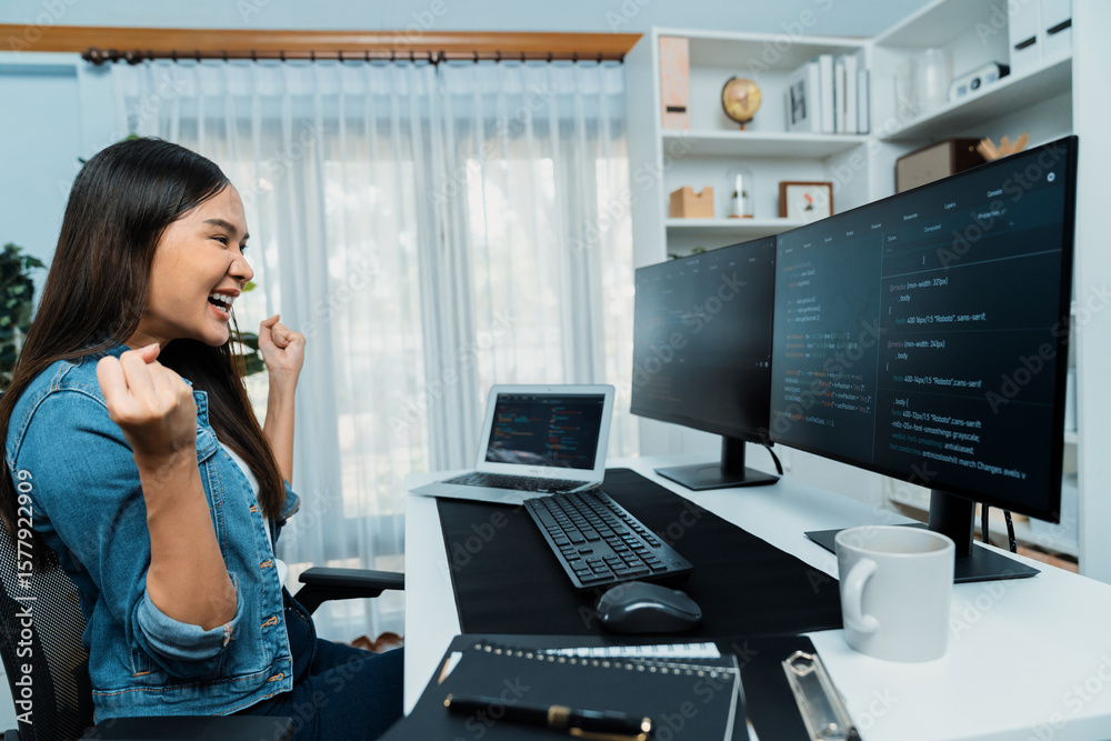 Poster young asian it developer creating raising fist up with successful information on pc with coding prog