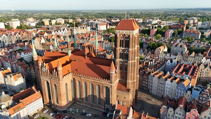 Aerial photo taken by drone over the historic tourist center of Gdansk, the city hall and the cathedral on a summer day, Poland, Europe