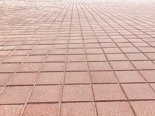 Textured brick pavement with ample copy space for design elements in an outdoor setting