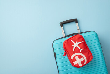 Blue travel suitcase with a red bag containing travel essentials, symbolizing safe travel....