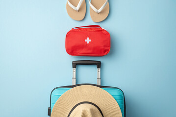 Traveling essentials for a summer journey include a suitcase, summer hat, flip-flops, and a first...