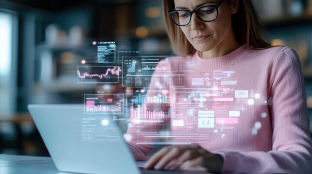 A Focused Woman Engaged in Data Analysis with Visual Representations on Her Laptop, Highlighting Modern Digital Analytics and Technology Connection