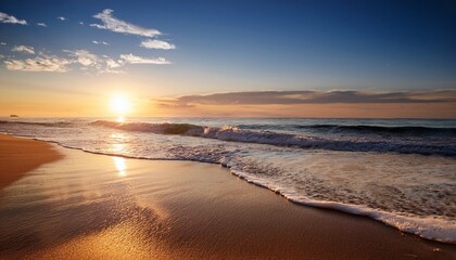 calm ocean waves gently lap against a sandy beach during sunset