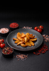 Grilled potato wedges with rosemary, cheese, salt and spices. Baked potato slices