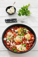 shakshuka, eggs poached in tomato vegetable sauce