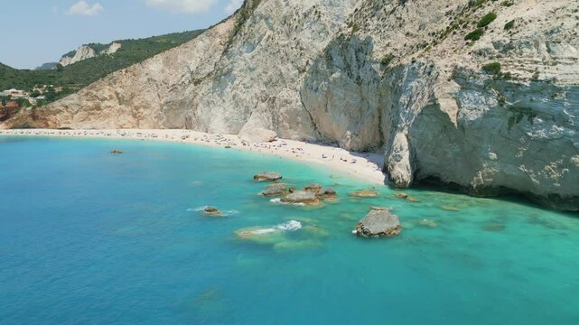 Spectacular aerial and ground views of Porto Katsiki beach on Lefkada island, Greece. Famous for its dramatic white cliffs and crystal-clear turquoise sea, this iconic Mediterranean spot 