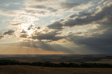 A landscape with a cloudy sky