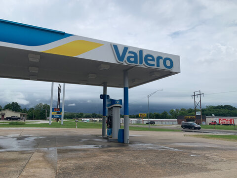 July 2025, Thunderstorms approaching in Oklahoma, a Valero gas station in the foreground.