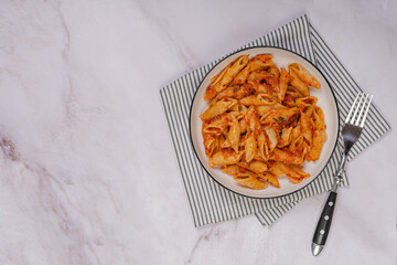 Pasta spaghetti Bolognese with red tomato souse on white plate on isolated white background.