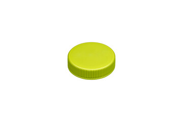 Light green plastic bottle cap with ribbed sides is isolated.
