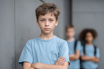 Fototapeta premium bullying victim, abused outsider standing apart of group of children