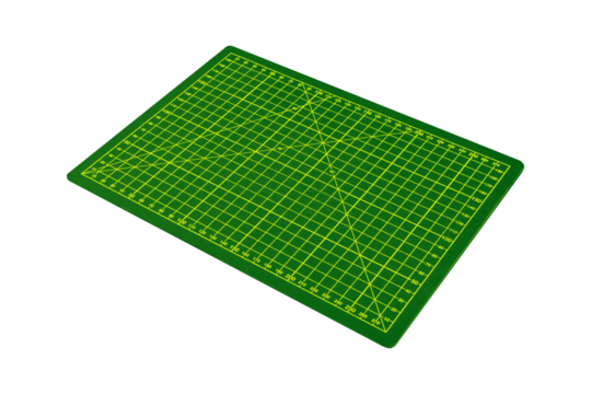 Green cutting mat with yellow grid shown in perspective is isolated.