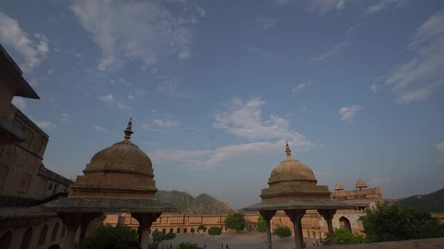 Dolly Out Shot from Amer Fort Courtyard Showing Chhatris and Historic Architecture, Jaipur, India