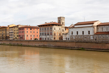 Historic buildings built along the edge of the Arno river, Pisa