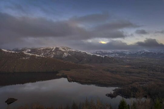 clouds moving over mountain lake time lapse