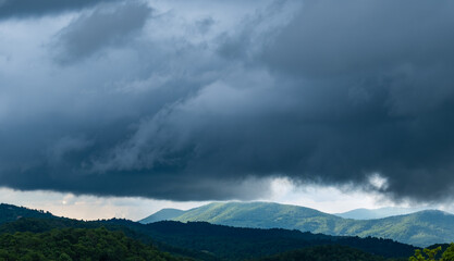 storm clouds dominating a mountain