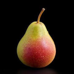 Fresh ripe pear with yellow-red gradient skin and water droplets isolated on black background, perfect for food photography or healthy eating concept