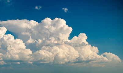 Blue sky with white clouds. Bright summer skyscape