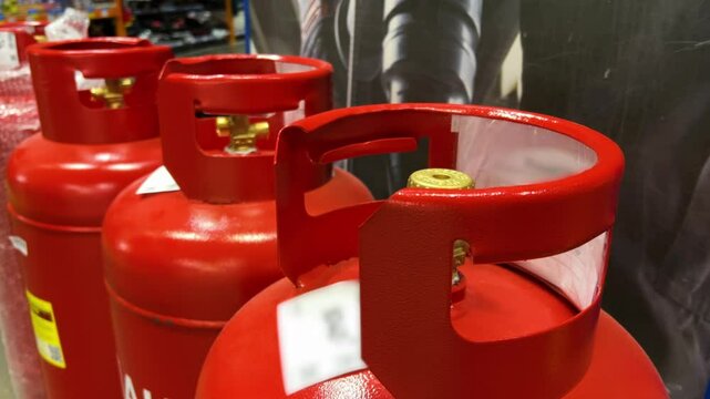 Gas cylinders red propane tanks household store energy fuel cooking heating commercial supply