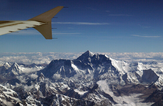 View of an aircraft wing Flying past Mount Everest, Himalayas, Nepal
