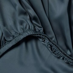 Soft and elegant dark fabric showcasing delicate elastic details in a layered design suitable for various styling options.