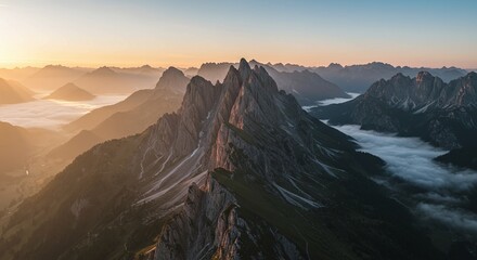 Majestic Mountain Range at Sunrise with Fog and Soft Lighting