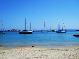 Crystal-Clear Waters and Yachts off Lavezzi Island, Corsica. This breathtaking aerial or coastal view captures the idyllic beauty of Lavezzi Island, nestled in the Strait of Bonifacio between Corsica