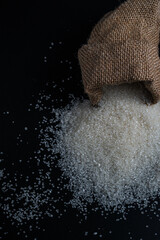 White sugar spilling from a burlap sack