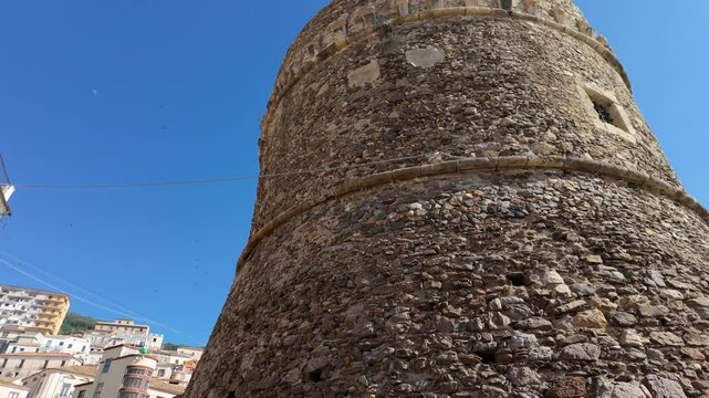 Low angle view of Murat Castle s stone walls against a clear blue sky in Pizzo Calabro, Italy