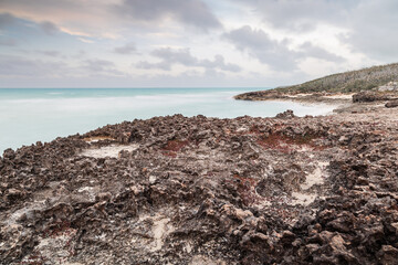 Sunset on the sandy beach of the Atlantic Ocean.