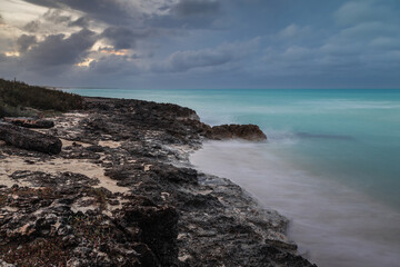 Sunset on the sandy beach of the Atlantic Ocean.