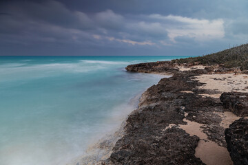 Sunset on the sandy beach of the Atlantic Ocean.