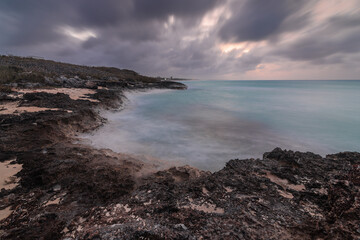 Sunset on the sandy beach of the Atlantic Ocean.