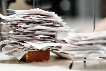 pile of spiked papers, restaurant and bar checks with orders on bar counter
