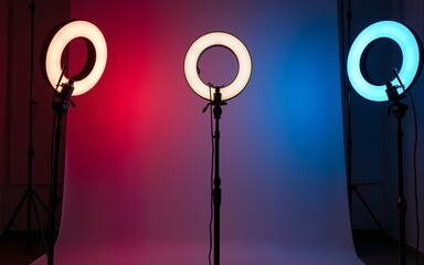 Professional ring light setup in vibrant studio at night. High quality