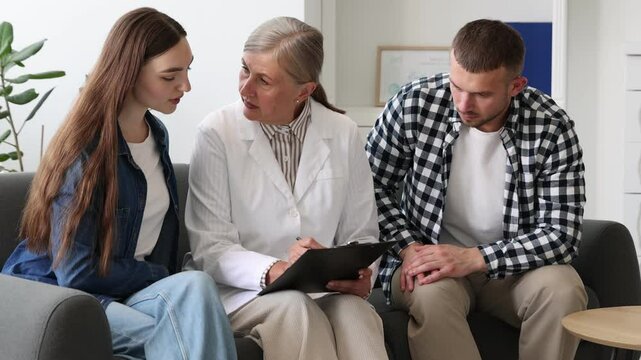 In vitro fertilization (IVF). Couple having consultation with doctor in reproductive clinic