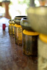 A row of singing bowls sit on stands in Tegalalang, Sebatu, Bali, Indonesia. The bowls are used for...